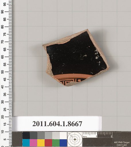 Terracotta fragment of a stemless kylix (drinking cup)
