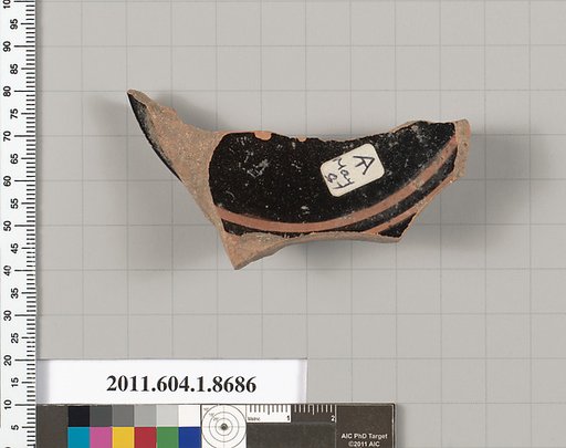Terracotta fragment of a stemless kylix (drinking cup)