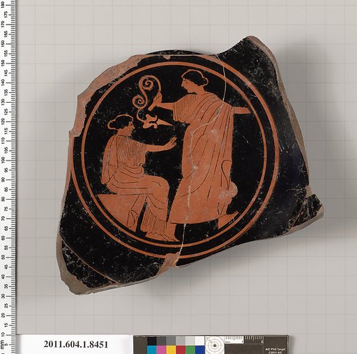 Terracotta fragment of a stemless kylix (drinking cup)