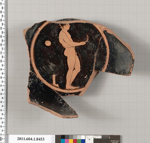 Terracotta fragment of a stemless kylix (drinking cup)
