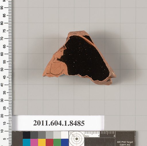 Terracotta fragment of a stemless kylix (drinking cup)