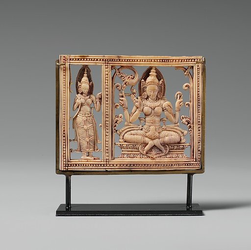 Plaque with Seated Dhanada-Tara and Attendant