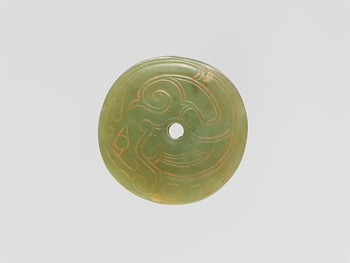 Circular plaque with incised decoration
