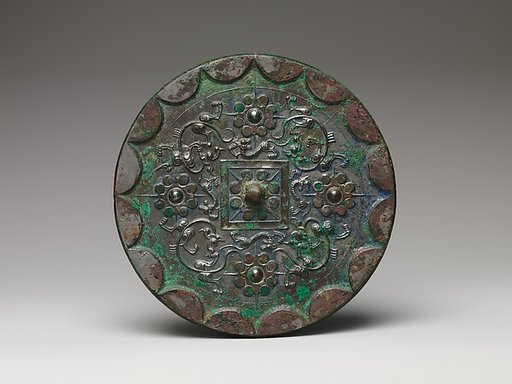 Mirror with dragons and knob-and-swirl design