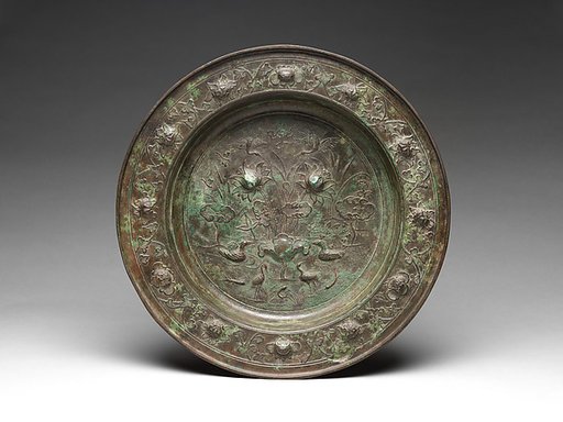 Basin with birds in a lotus pond