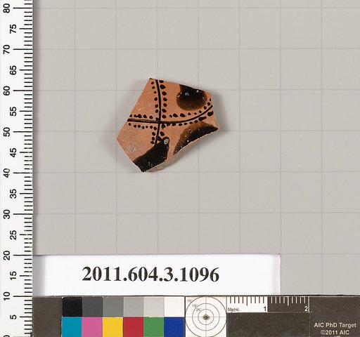Terracotta fragment of a mastoid (drinking cup with narrow base)