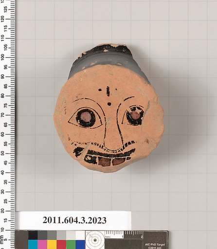 Terracotta fragment of a kylix (drinking cup)