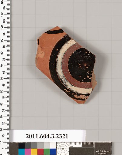 Terracotta fragment of a kylix: eye-cup (drinking cup)