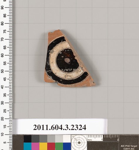 Terracotta fragment of a kylix: eye-cup (drinking cup)