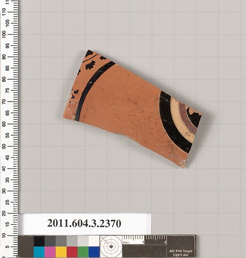 Terracotta fragment of a kylix: eye-cup (drinking cup)