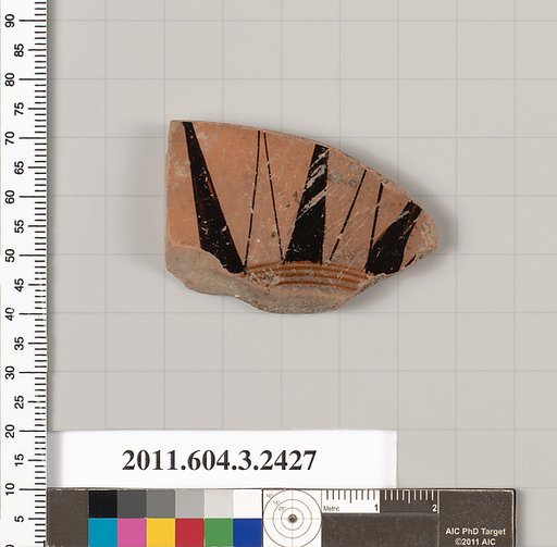 Terracotta fragment of a kylix: eye-cup (drinking cup)