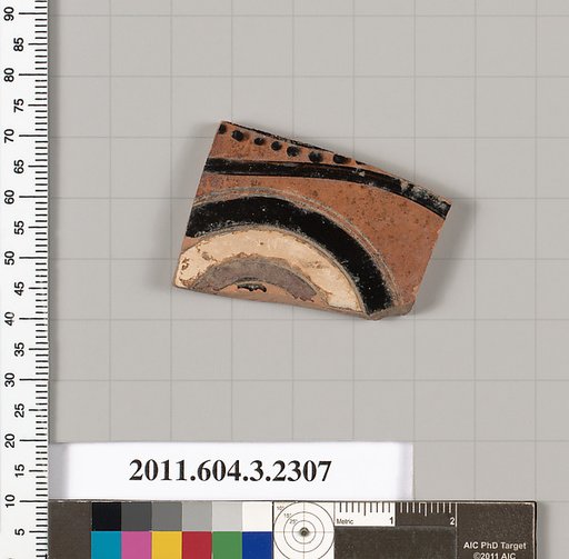 Terracotta fragment of a kylix: eye-cup (drinking cup)