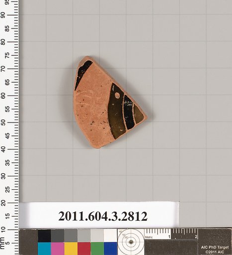 Terracotta fragment of a kylix: eye-cup (drinking cup)