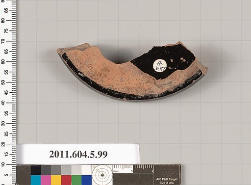 Terracotta fragment of a stemless kylix (drinking cup)