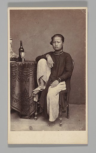 [Studio Portrait: Woman Seated Beside a Table, Singapore]