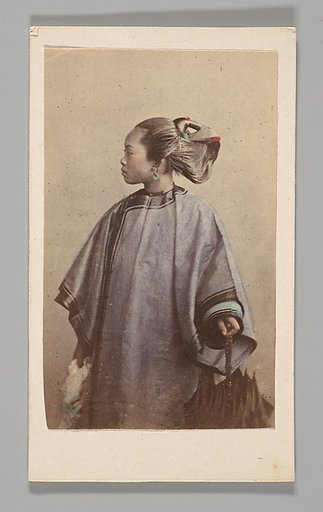 [Studio Portrait: Woman Standing in Profile Holding Umbrella, Hong Kong]