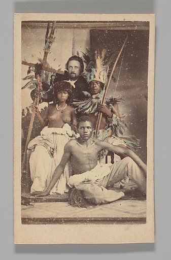 [Studio Portrait: Seated Group portrait with Man in European Dress and Three Indigenous people]