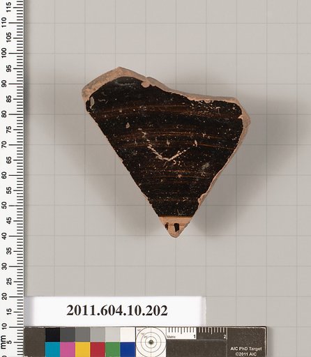 Terracotta fragment from a kylix (drinking cup)