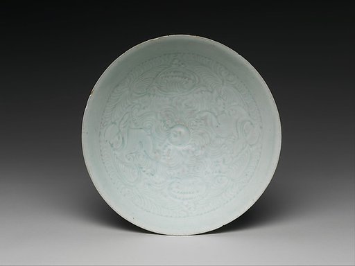 Bowl with two boys and foliage