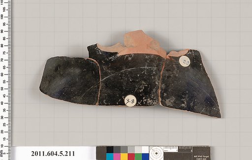 Terracotta fragment of a kylix (drinking cup)