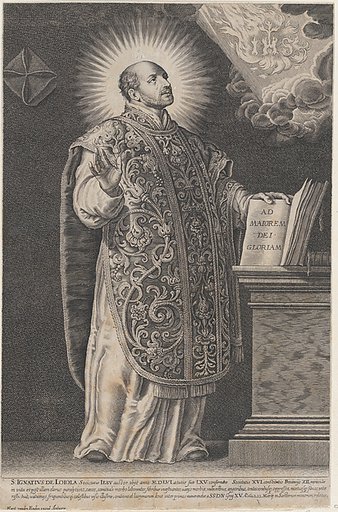 Saint Ignatius Loyola, standing and holding an open book