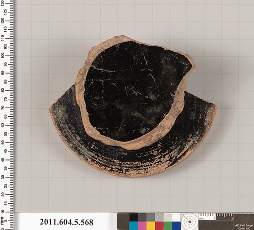 Terracotta fragment of a stemless kylix (drinking cup)