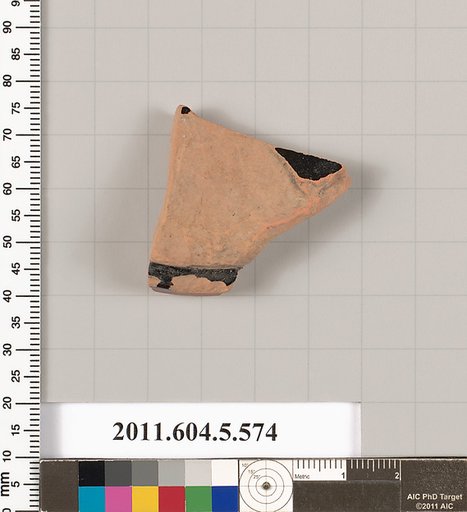 Terracotta fragment of a stemless kylix (drinking cup)