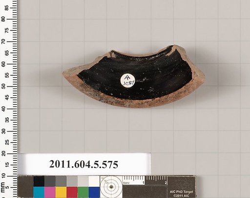 Terracotta fragment of a stemless kylix (drinking cup)