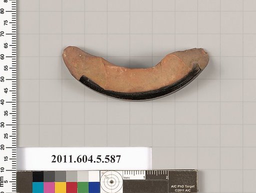 Terracotta fragment of a stemless kylix (drinking cup)