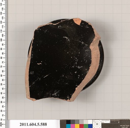 Terracotta fragment of a stemless kylix (drinking cup)