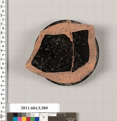 Terracotta fragment of a stemless kylix (drinking cup)