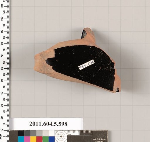 Terracotta fragment of a stemless kylix (drinking cup)
