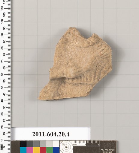 Fragment of a statuette of a woman