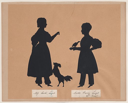 Kate and Harry Lucas, playing with a dog and a bird