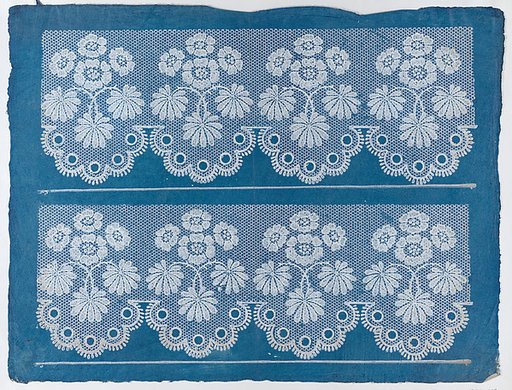 Blue sheet with two borders with a white floral and lace pattern