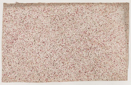 Sheet with an overall red speckle pattern