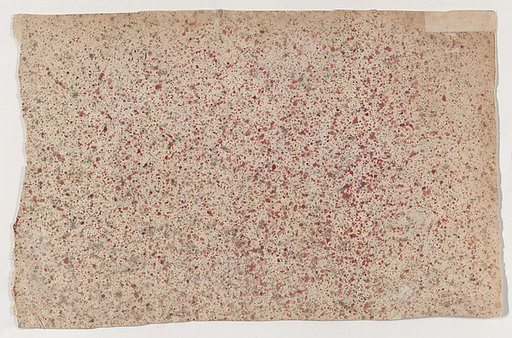 Sheet with an overall red speckle pattern