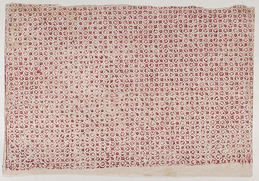 Sheet with a red geometric and floral pattern