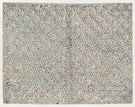 Book cover with yellow floral pattern atop blue curved lines