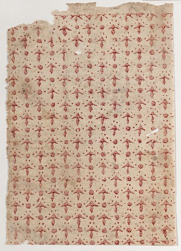 Sheet with overall pattern of arrow shapes and dots