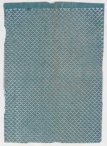 Sheet with overall pattern of dots in triangular shapes