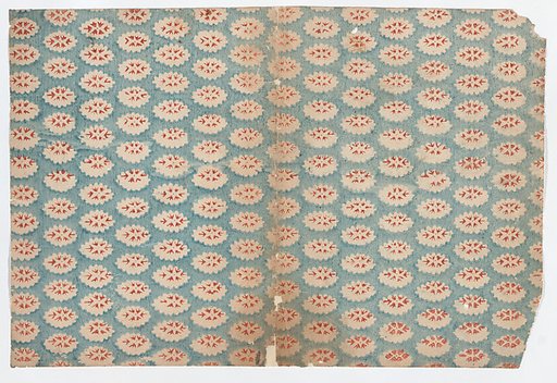 Sheet with overall pattern of ovals with red designs