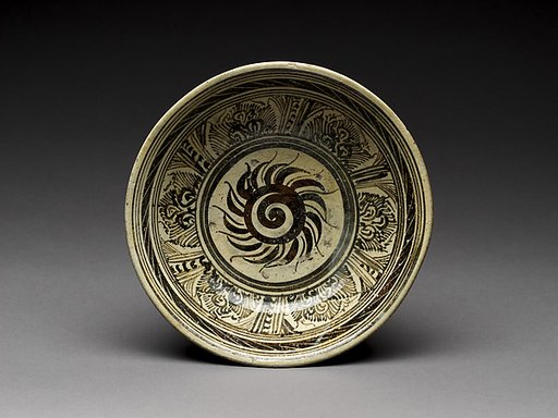 Bowl with flaming solar disk design