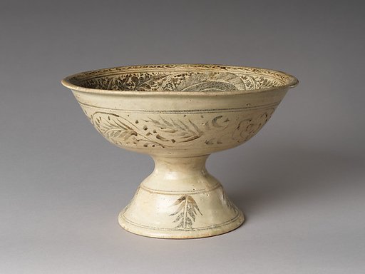 Pedestal dish with catfish and aquatic plants décor