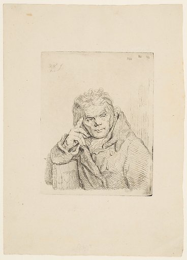 An old man in a fur coat sitting on a chair