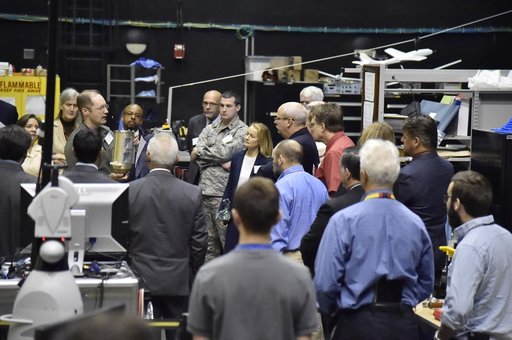 Members of the Science and Technology Partnership Forum Listen to a Presentation about In-Space Assembly and Satellite Servicing