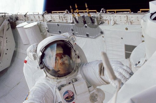 Astronaut Leestma during an EVA in the aft cargo hold