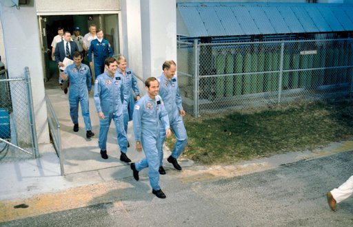STS 41-C crew move to transfer van for trip to Launch Pad 39B