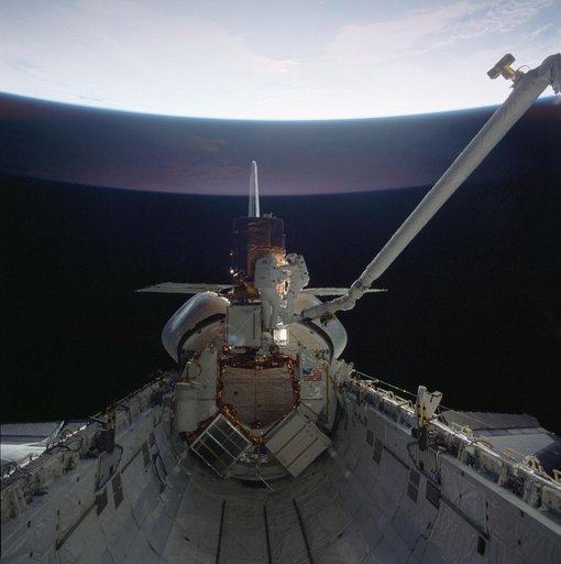41-C mission specialists reapir captured Solar Maximum Mission Satellite