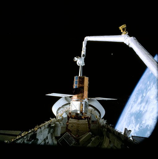 41-C mission specialists reapir captured Solar Maximum Mission Satellite
